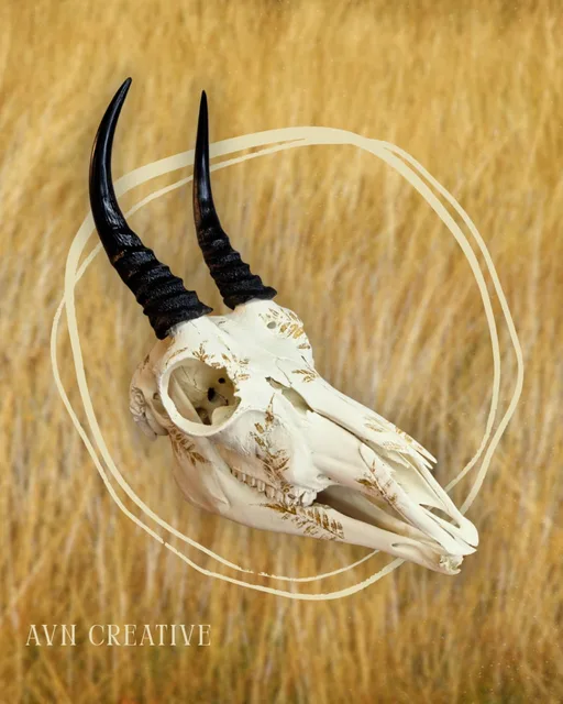 Antelope skull with long ridged horns, hand-painted with delicate gold botanical detail